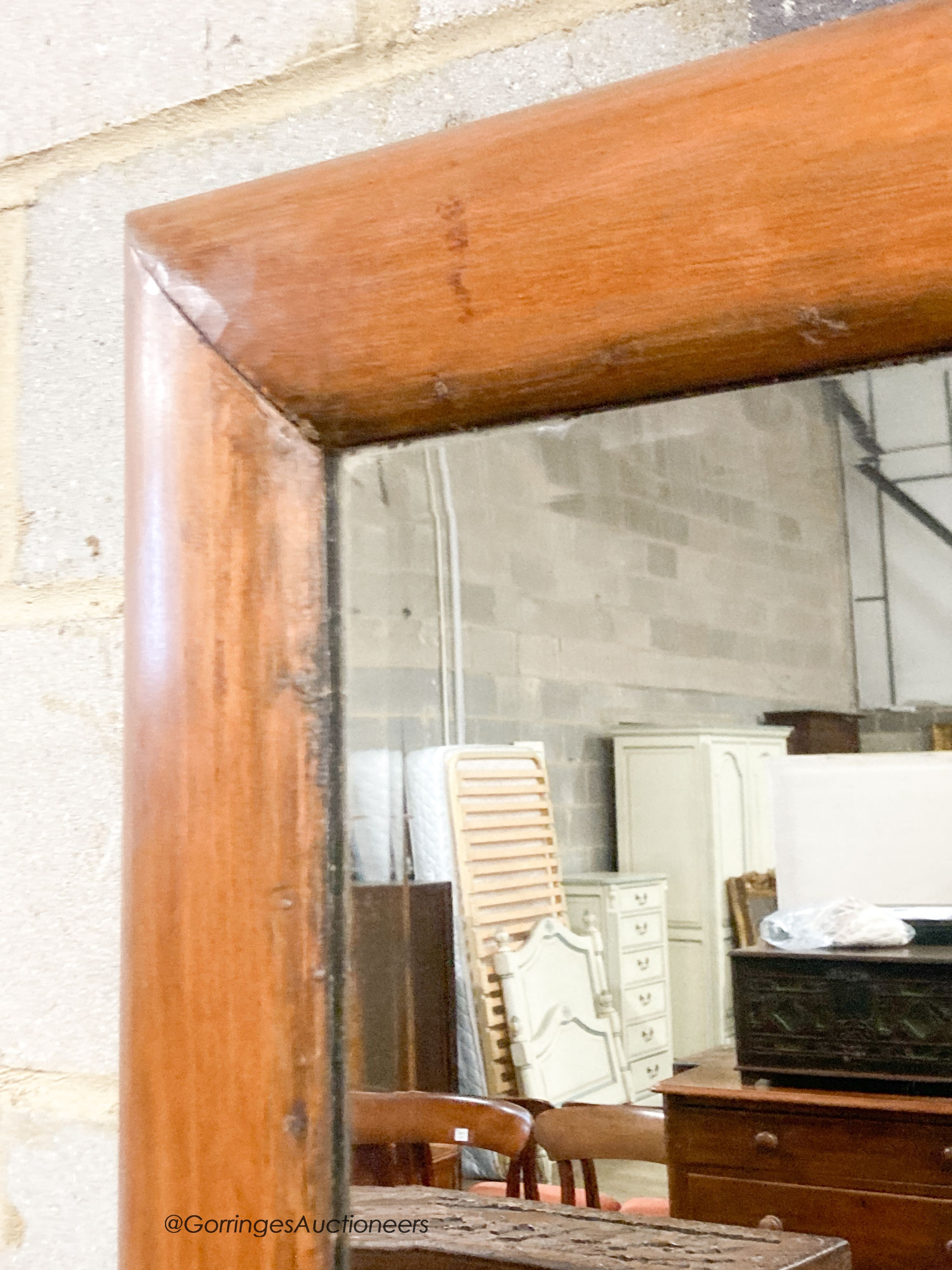 A late Victorian antique style pine cushion mirror, width 70cm, height 66cm